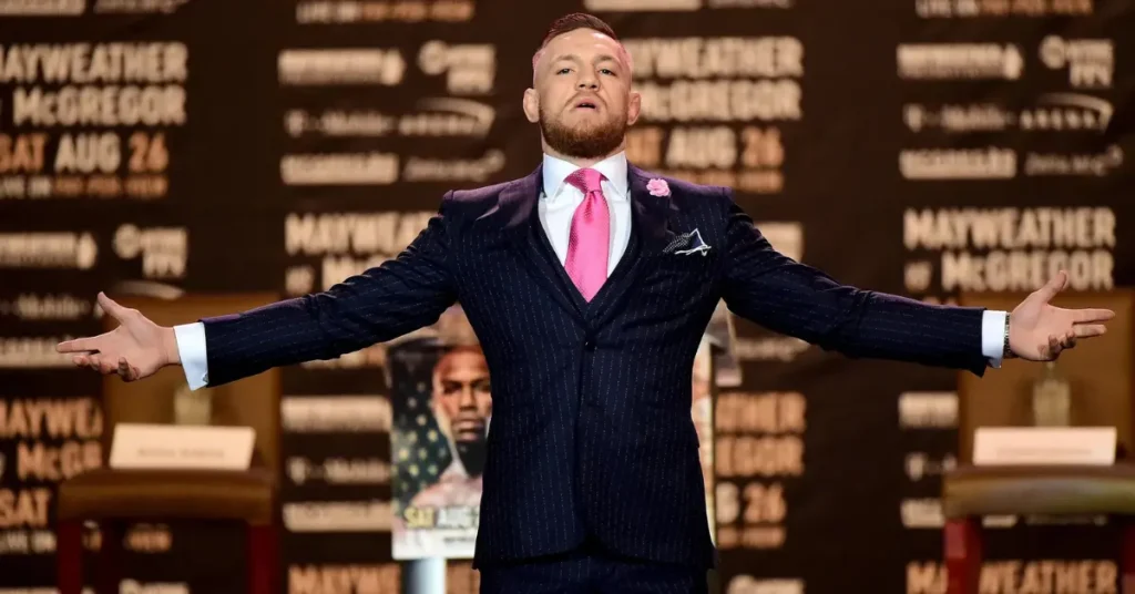Conor McGregor Brings Back the Iconic 'Fu*k You' Suit at UFC 329 Media Day.